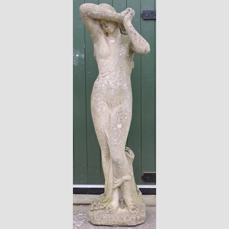 A reconstituted stone garden statue, on a plinth base,