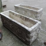 A pair of white reconstituted stone garden planters,