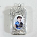 A silver and enamel vesta of a jockey,