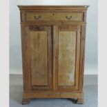 An antique pine cupboard, with a single drawer and cupboards below,