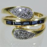 An 18 carat gold sapphire and diamond dress ring,