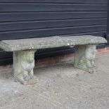 A reconstituted stone garden bench, with lion supports,