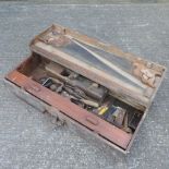 A carpenter's tool chest, containing hand tools,