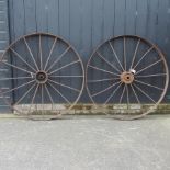 A pair of antique iron cartwheels,