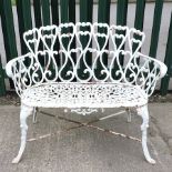 A white cast iron garden bench,