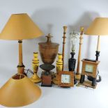 A carved wooden urn, together with three wooden table lamps, two mantle clocks, a marbled vase,