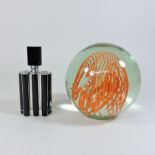 An Art Deco style scent bottle, together with a glass ball paperweight,