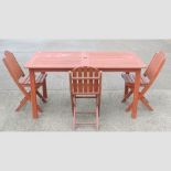A teak slatted garden table, 151cm,