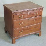 An 18th century mahogany chest of drawers fitted with brushing slide,