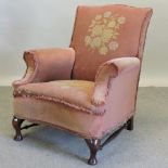 An early 20th century tapestry upholstered armchair