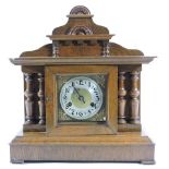 An Edwardian walnut cased mantle clock, with a painted dial,