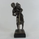 A bronzed figure of an Eastern gentleman,