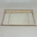 A cream and gold painted over mantle mirror,