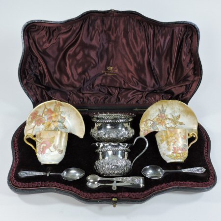 A Victorian Doulton coffee set, comprising a pair of gilt coffee cups and saucers, printed marks,