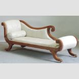 A Regency style cream upholstered chaise longue,