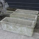 A collection of three reconstituted stone garden troughs,