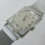 A Longines diamond set ladies wristwatch, the signed oval dial with diamond set numerals,