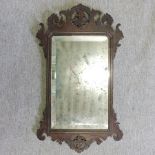 A George III mahogany fret carved wall mirror,