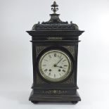 A 19th century continental ebonised and gilt metal mounted bracket clock, with a silvered dial,