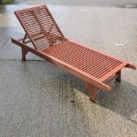 A hardwood sun lounger,