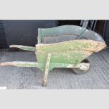 A painted wooden wheel barrow,
