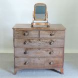 A George III mahogany chest of drawers on swept bracket feet,