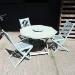 A green painted teak garden table, 100 x 100cm,