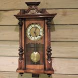 A Victorian walnut cased wall clock
