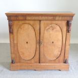 A 19th century walnut and inlaid side cabinet, on a plinth base,