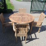 A teak circular garden table, 122cm diameter,