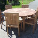 A teak circular garden table, 150cm,