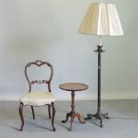 A bronzed George III style standard lamp together with a Victorian mahogany balloon back chair and