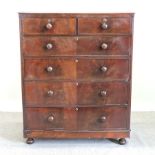 A Victorian mahogany chest of drawers, on bun feet,