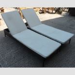 A pair of rattan loungers,
