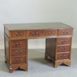 A reproduction yew wood pedestal desk,