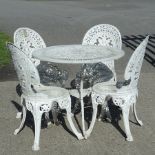 A white painted metal circular garden table,