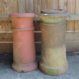 A terracotta chimney pot, together with another,