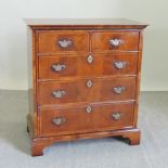 A walnut drinks cabinet, in the form of a Georgian style chest,