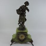 A late 19th century spelter and green onyx mantle clock,