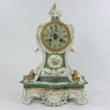 A 19th century French porcelain cased mantel clock on stand,