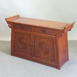 A Chinese carved hardwood sideboard,