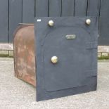 A black painted iron bread oven,