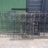 A pair of black painted wrought iron gates, each 111cm,