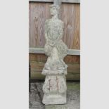A reconstituted stone figure of Pan,