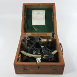 An early 20th century sextant, by Henry Hughes and son, in a wooden case,