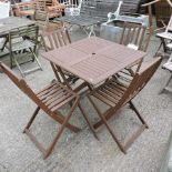 A hardwood slatted folding garden table, 80 x 80cm,