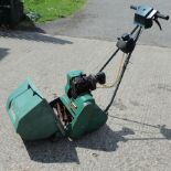 A Qualcast petrol lawn mower
