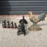 An iron painted door stop in the shape of a cockerel,