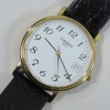 A Tissot gentleman's gold plated wrist watch, on a leather strap,