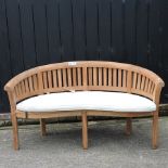 A teak carved garden bench,